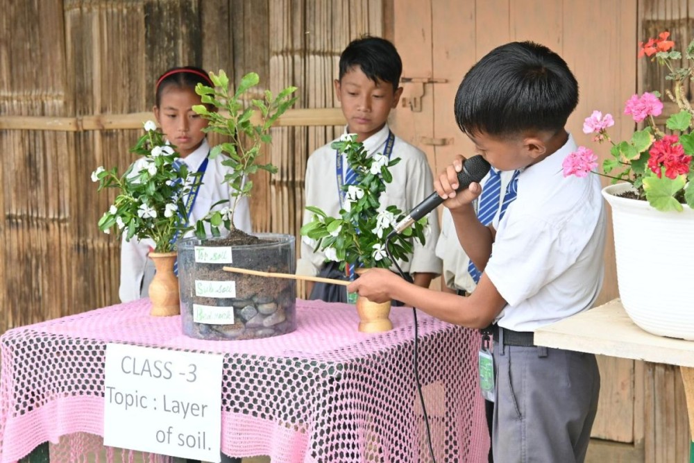 Students display projects during the first ever science exhibition of St John School, Kiusam Town held on June 20.